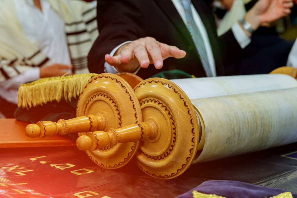 Barmitzvah man with reading Torah scrolls near Bar Mitzva in the Jewish Torah